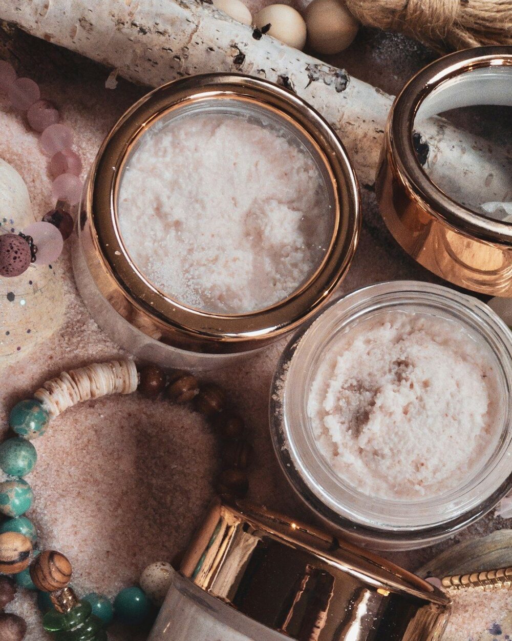 Copper-lidded jars of sugar scrub